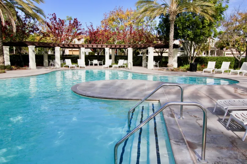A pool with chairs around it at Davenport community in Ladera Ranch, California.