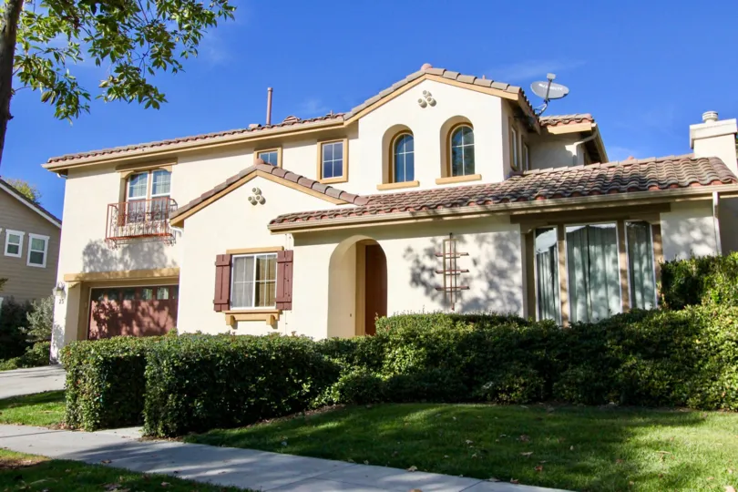A beautiful home with lush green front yard two stories at The Potters Bend Community in Ladera Ranch California