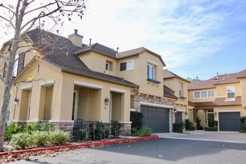 Leafs sit in the driveway at the Sycamore Grove townhomes