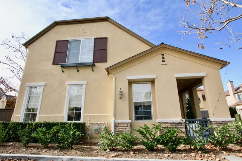 A two story beige house in the community of Sycamore Grove in the city of Ladera Ranch, California.