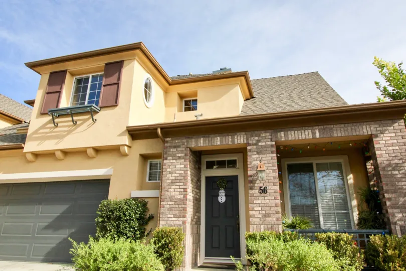 Bright sunny day with plants and entrance door of Sycamore Grove of Ladera Ranch