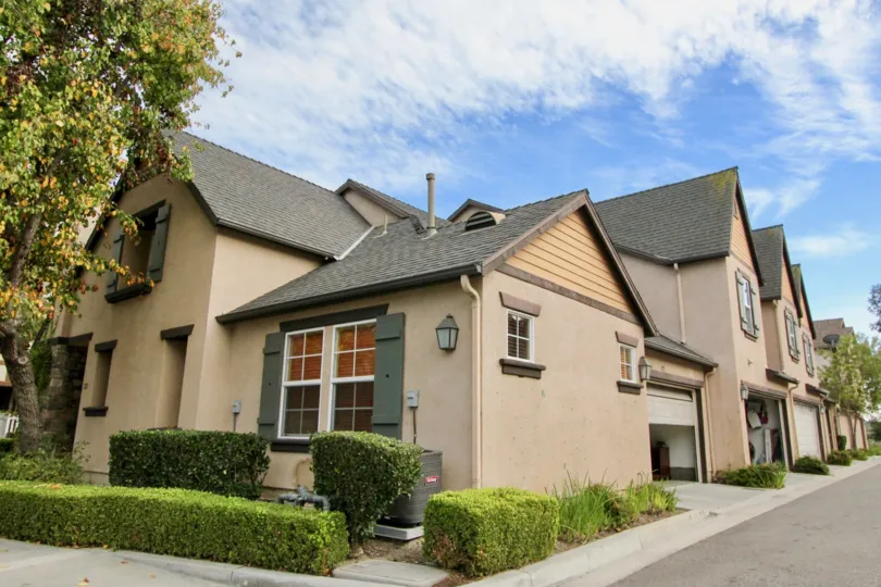 the house with a car parking room with decorated gate endings and good architecture