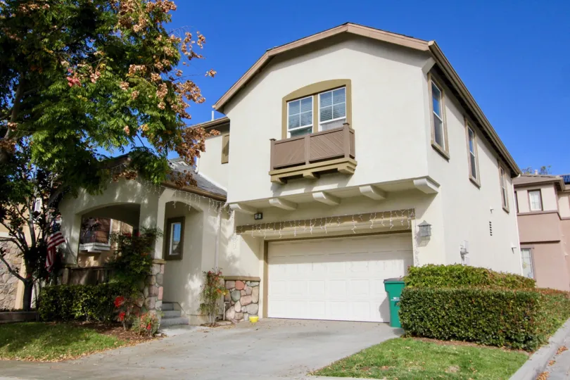 beautiful sunny day green trees and big detached house in Valmont
