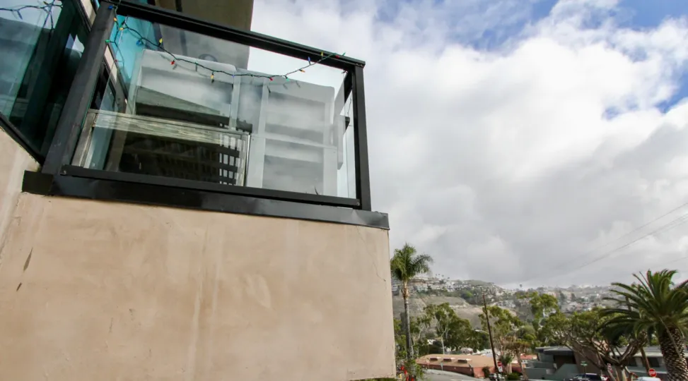 a warm day in the 174 cliff drive with a building that has glass wall