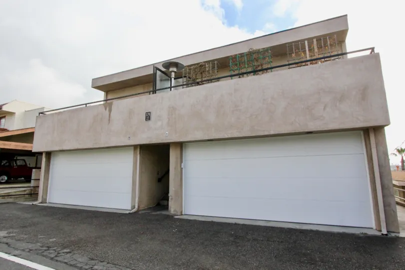 Cloudy sky with garages at 174 Cliff Drive in Laguna Beach, CA.