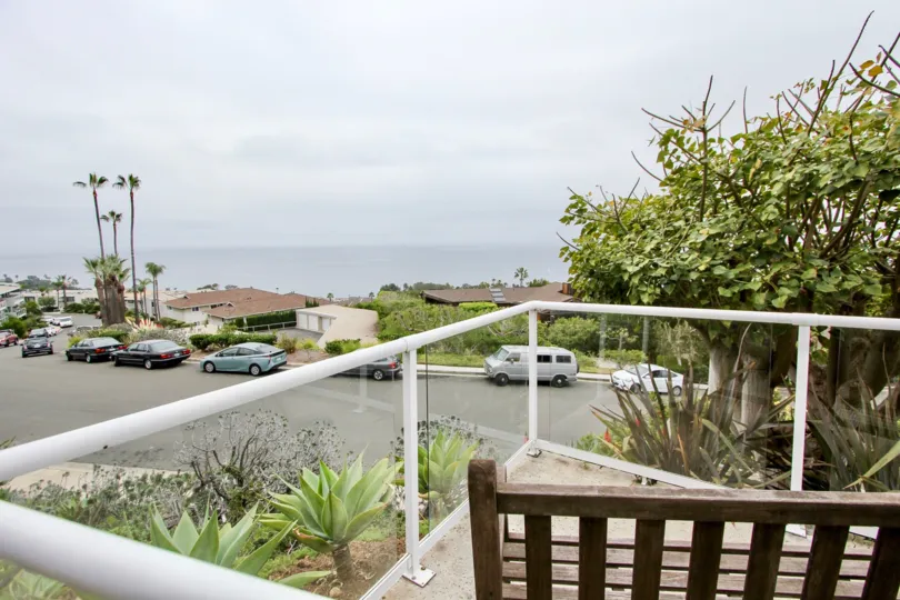 A view of a Aliso Laguna street, from a home's second floor balcony.