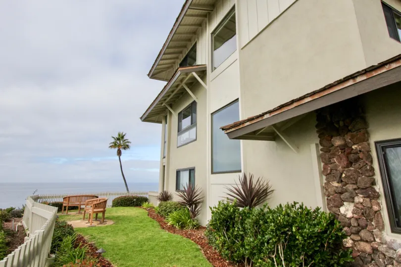 A NICE BEACH HOUSE WITH INFRONT OF RELAXING CHAIR WITH OUR NEIGHBOR