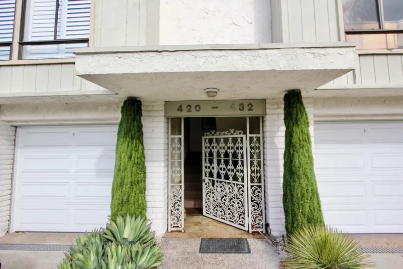 A sunny day in the Laguna North Shores with a gate and plant.