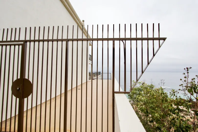 Metal fence overlooking the beach in Laguna Royale, Laguna Beach, California