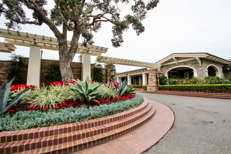 a warm day in the montage beach villas with gated community that has beautiful garden outside the gate