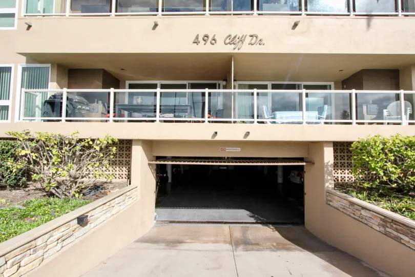 A bright morning at the parking garage entrance for one of the Ocean Cliff Manors, with luxurious balconies above