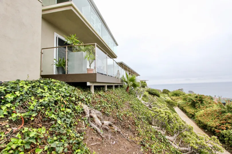 a pleasant day in the ocean vista with a building that has balcony in the glass