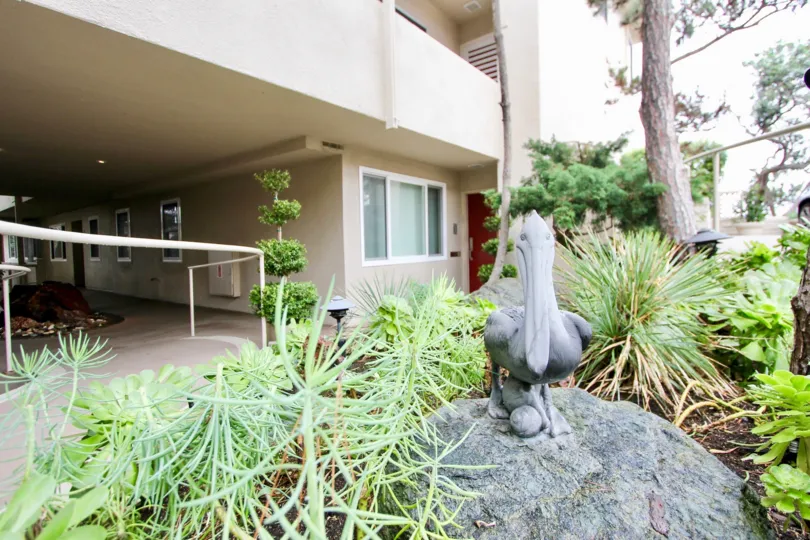 A beautiful day in the Table Rock with a sculpture in front of a house.