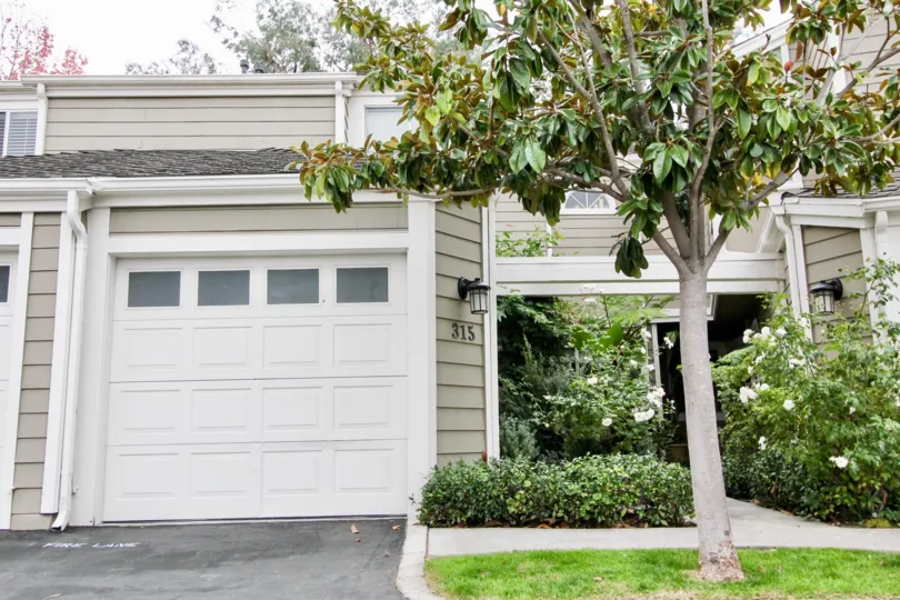 THE 315 APARTMENT IN THE TERRACES AT CANYON HILLS WITH THE SHUTTERS, FLOWER PLANTS, GRASSLAND, TREES