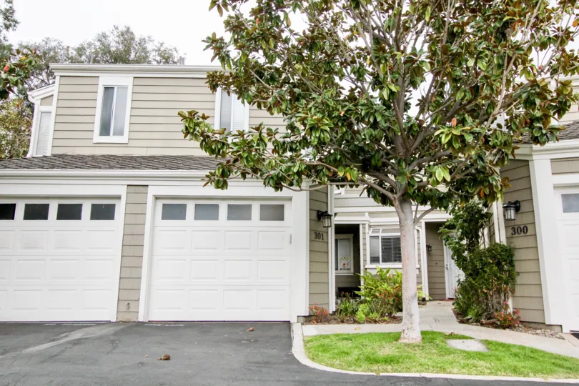 THE 301 APARTMENT IN THE TERRACES AT CANYON HILLS WITH THE LAWN, TREES, LAMP