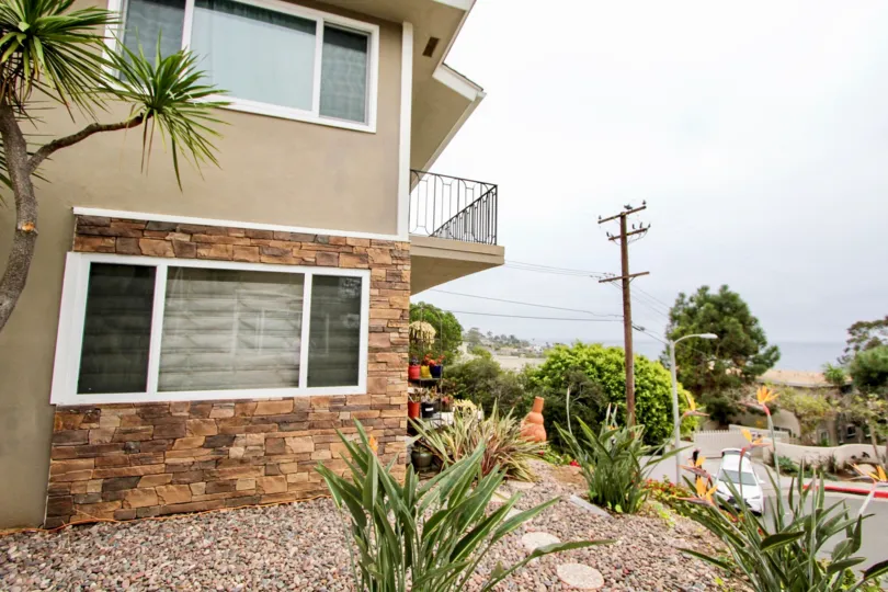 Car is parking on the door and transformer placed with plants and bushes in Wesley Pacific