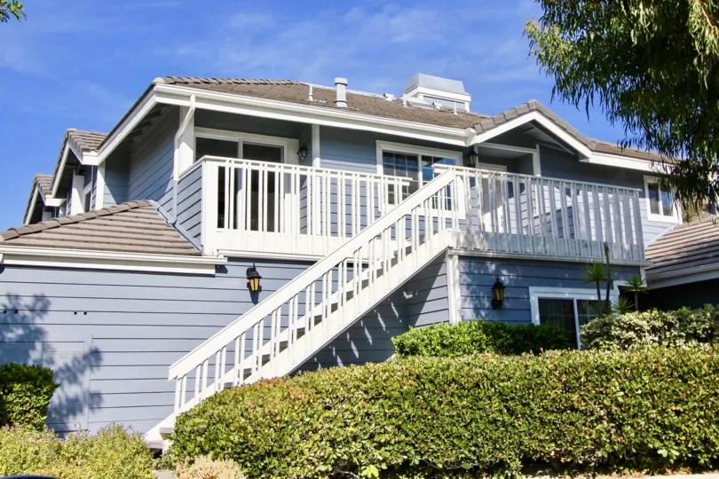 Wooden stair case to the duplex building from outside also in Beacon Hill Vistas.
