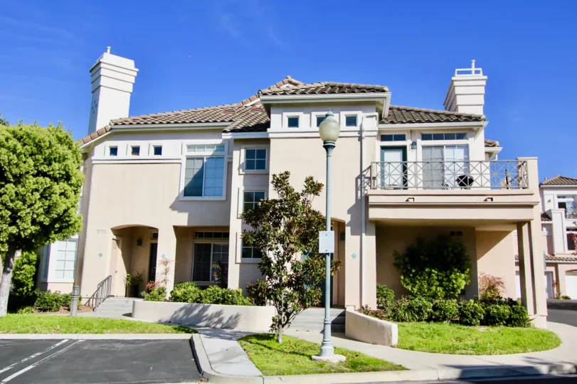 Awesome VIlla on a bright sunny day with trees and lawn in Breakers of Laguna Niguel