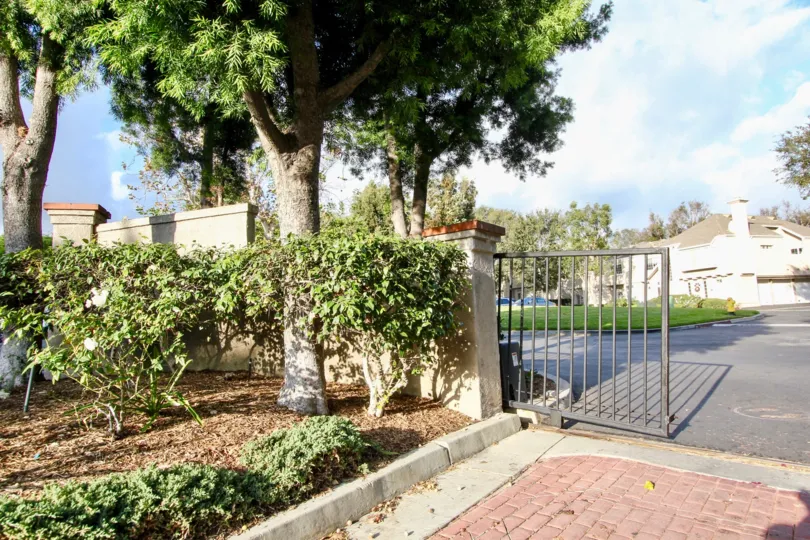 A gate is situated in front of a building at Bridgeport Terrace.