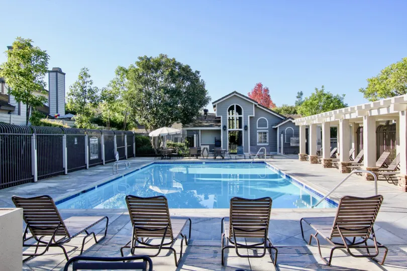 Rectangle shape swimming pool and relaxing chairs in Camden Court.