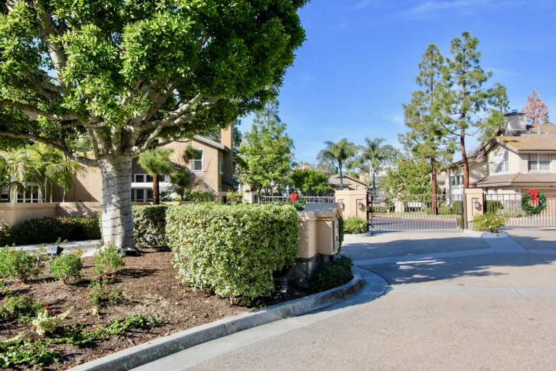 THE HOUSE IN THE CAMERAY POINTE WITH THE ROAD, PLANTS, TREES, STEEL GATE