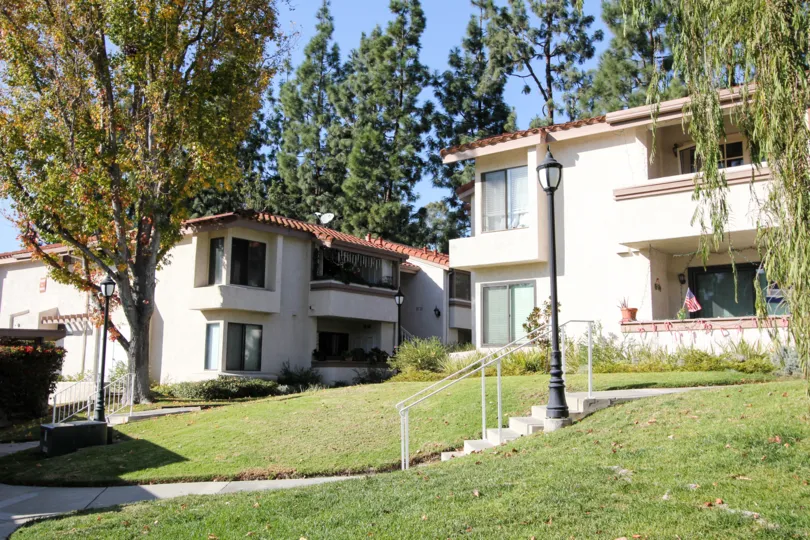 Several tan apartment complex's on a sunny day in Casa La Paz community in Laguna Niguel, California.