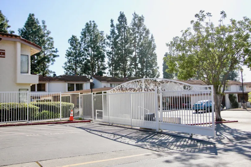 A gorgeous white security gate & fence in Casa La Paz in Laguna Niguel CA