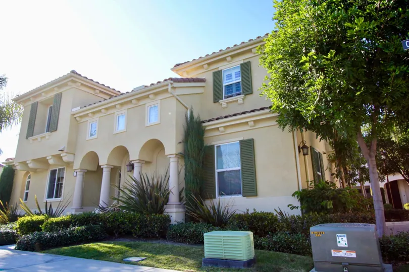blue sky big detached house and green hedges in Cornerstone