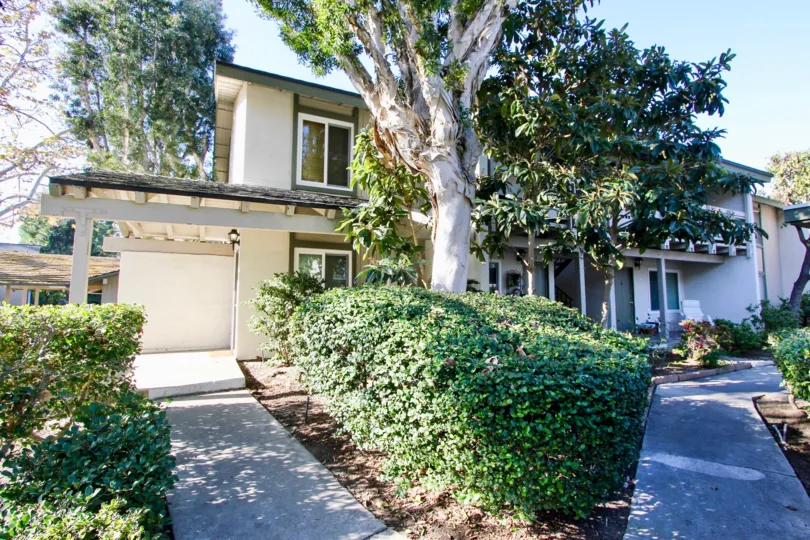 A white home with trees in Hillhurst Condos community in Laguna Niguel, California.