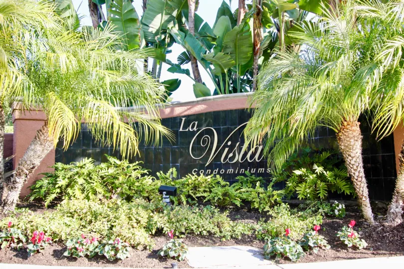 THE VILLAS WITH THE LA VISTA CONDOMINIUMS WALL, PLANTS, TREES