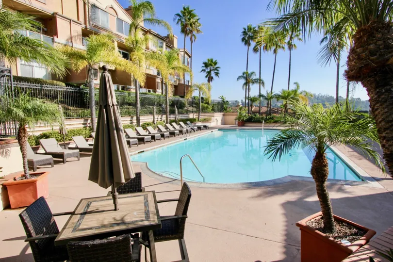 THE VILLAS IN THE LA VISTA WITH THE SWIMMING POOL, UMBRELLA, CHAIRS