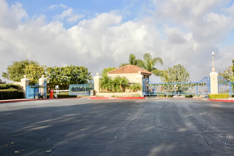 THE HOME IN THE LAGUNA SUR WITH THE THAR ROAD, GATE, PLANTS, TREES