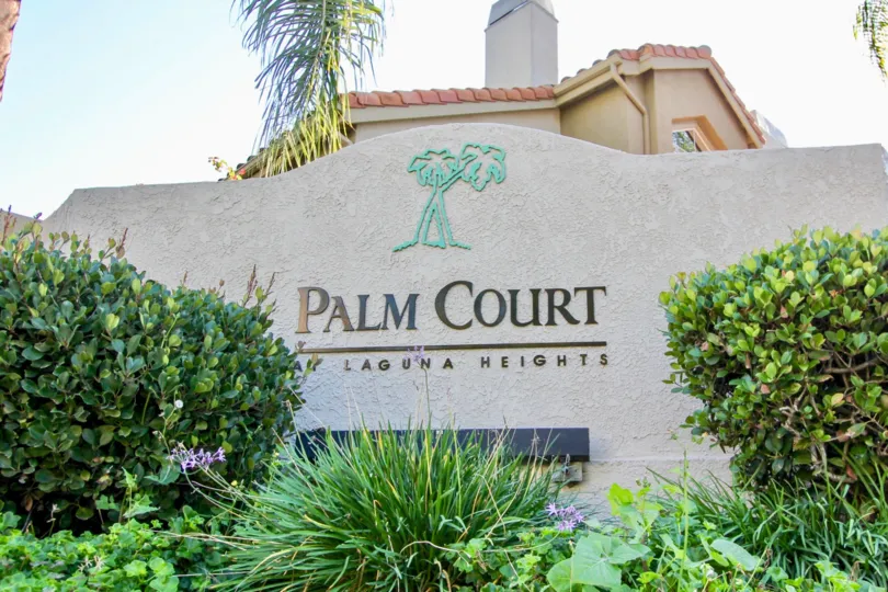Plants and front sign at Palm Court in Laguna Niguel, CA
