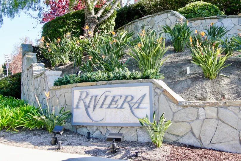 beautiful sunny day green plants Rivira sign in Riviera