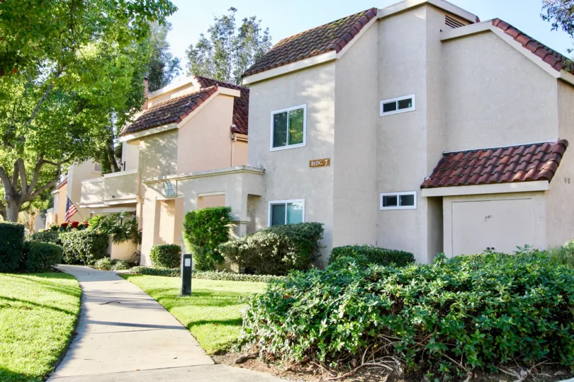 Sunny day on a large homes with bushes around it in Villa Mira community in Laguna Niguel, California.