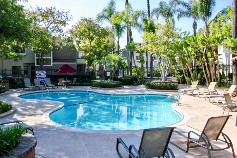 Chairs and a pool at Village Niguel Terrace I in Laguna Niguel, CA