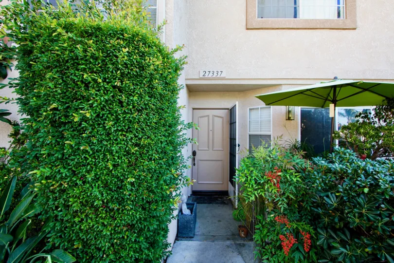 Hedges and front door at Village Niguel Terrace II at Laguna Niguel, CA