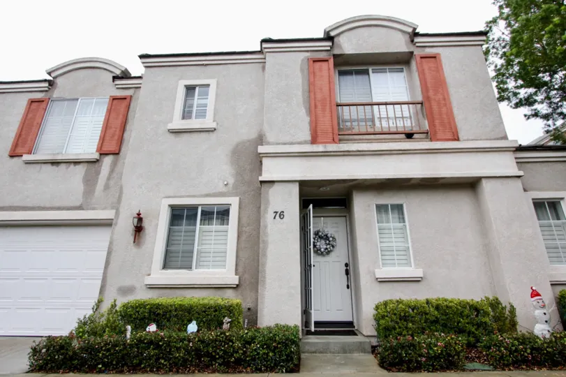 A large grey home with a garage in Brittany at Foothill Ranch community in Lake Forest, California.