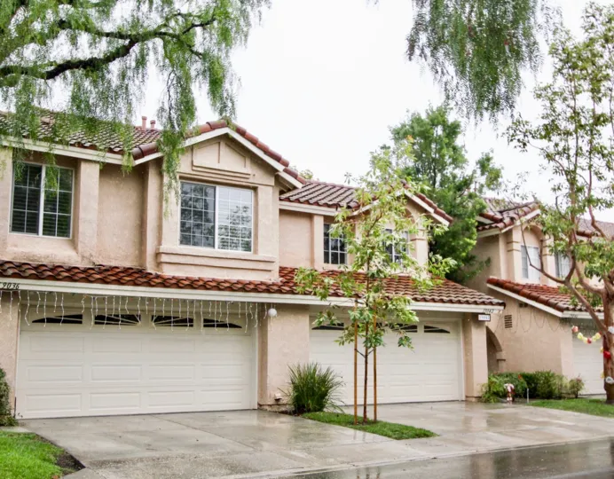 Beautiful view of a villa on a rainy day with trees in Canyon Rim of Lake Forest