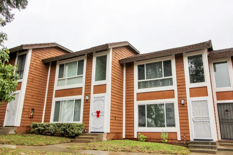 An old model house is located Cedar Glen with white doors.