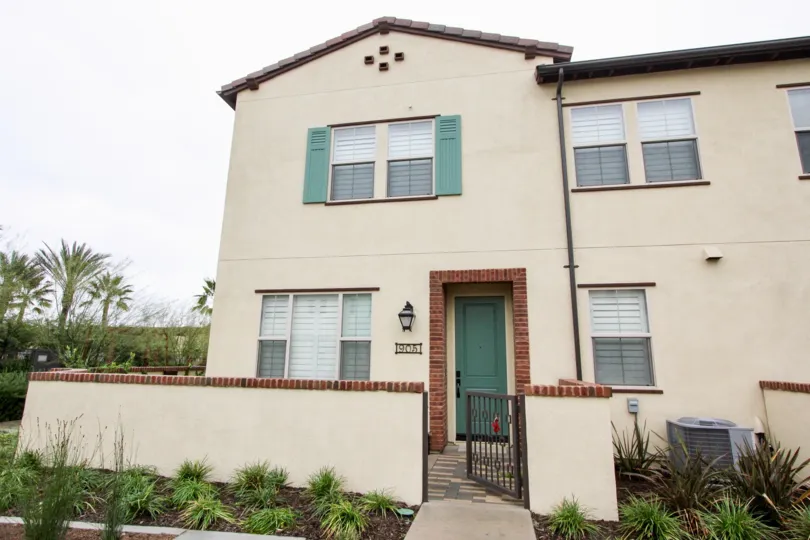 A villa with main gate and plants in front of El Paseo of Lake Forest