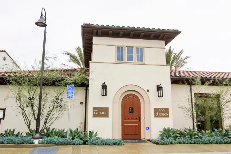 An old building is there in the El Paseo with a street light nearby.