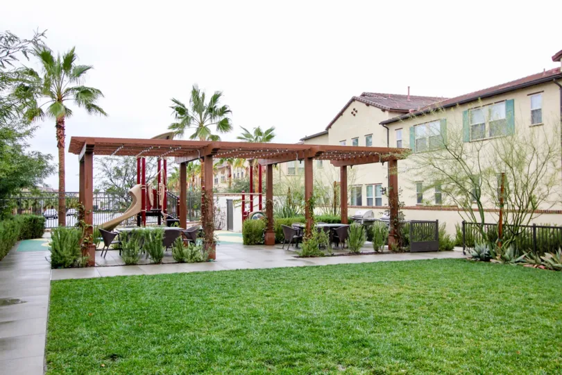 A Green Lawn with palm trees Near Villa in El Paseo of Lake Forest