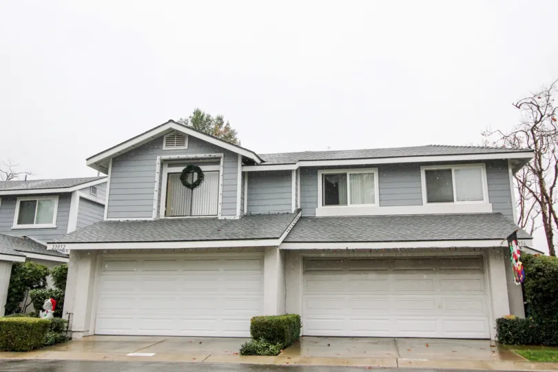 An ash color house in the Grandview Crest with a tree.