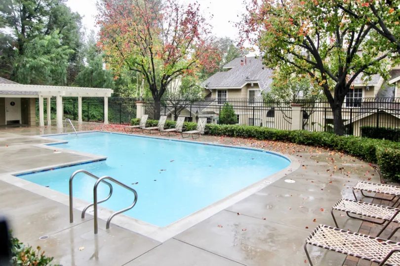 A SIGHT OF BEAUTIFUL BUILDING WITH SWIMMING POOL LOCATED IN GREEN AREA
