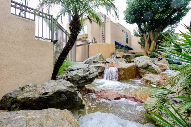 There are some rocks and water fall in the Le Parc.