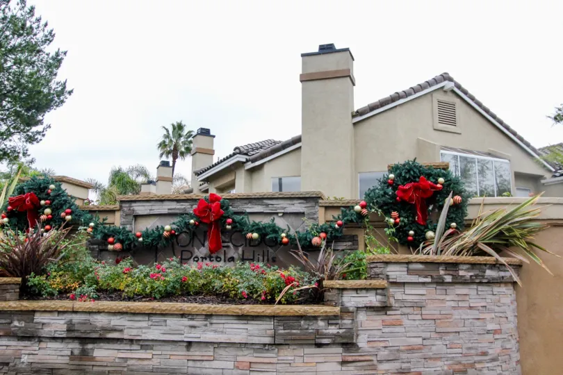 Holiday is in the air at the Montecido, Lake Forest graced by the wreath and flowers.