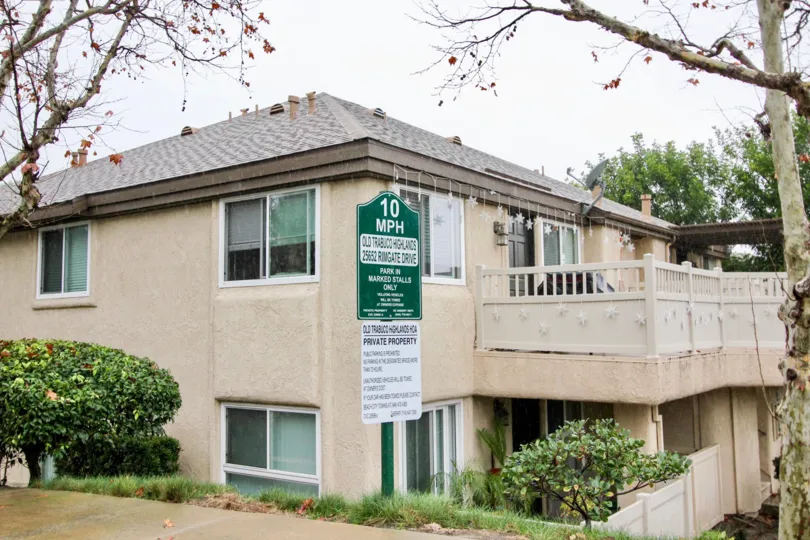 A tan apartment complex with decrations in Old Trabuco Highlands community in Lake Forest, California.