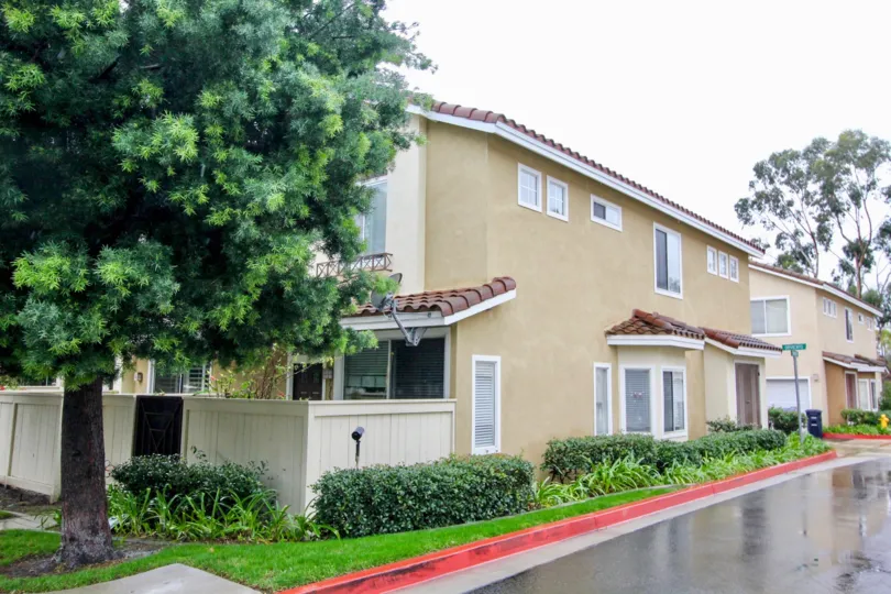 View of building, private patios, and street Palermo, Lake Forest, California.