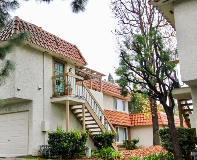 A wooden stair in front of a house in the Lake Forest.